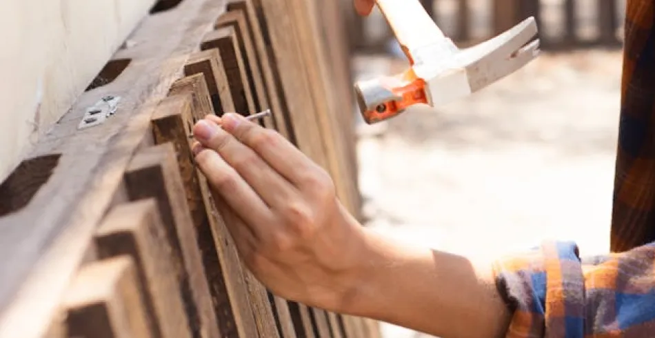 Hammering a nail into wood